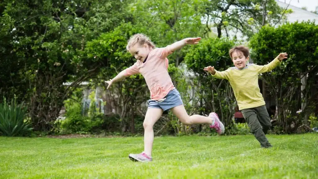 Siblings playing outside reduced screen time